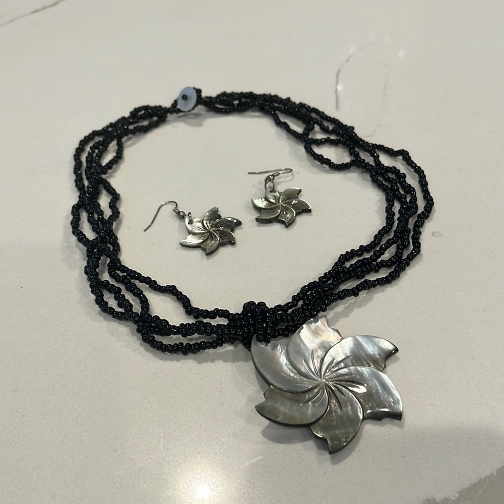 Black beaded flower necklace and matching earrings
